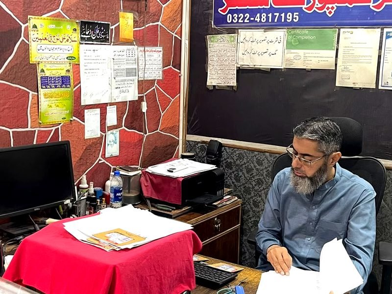 Preparing documents at Umer Composing Center, Harbanspura, Lahore